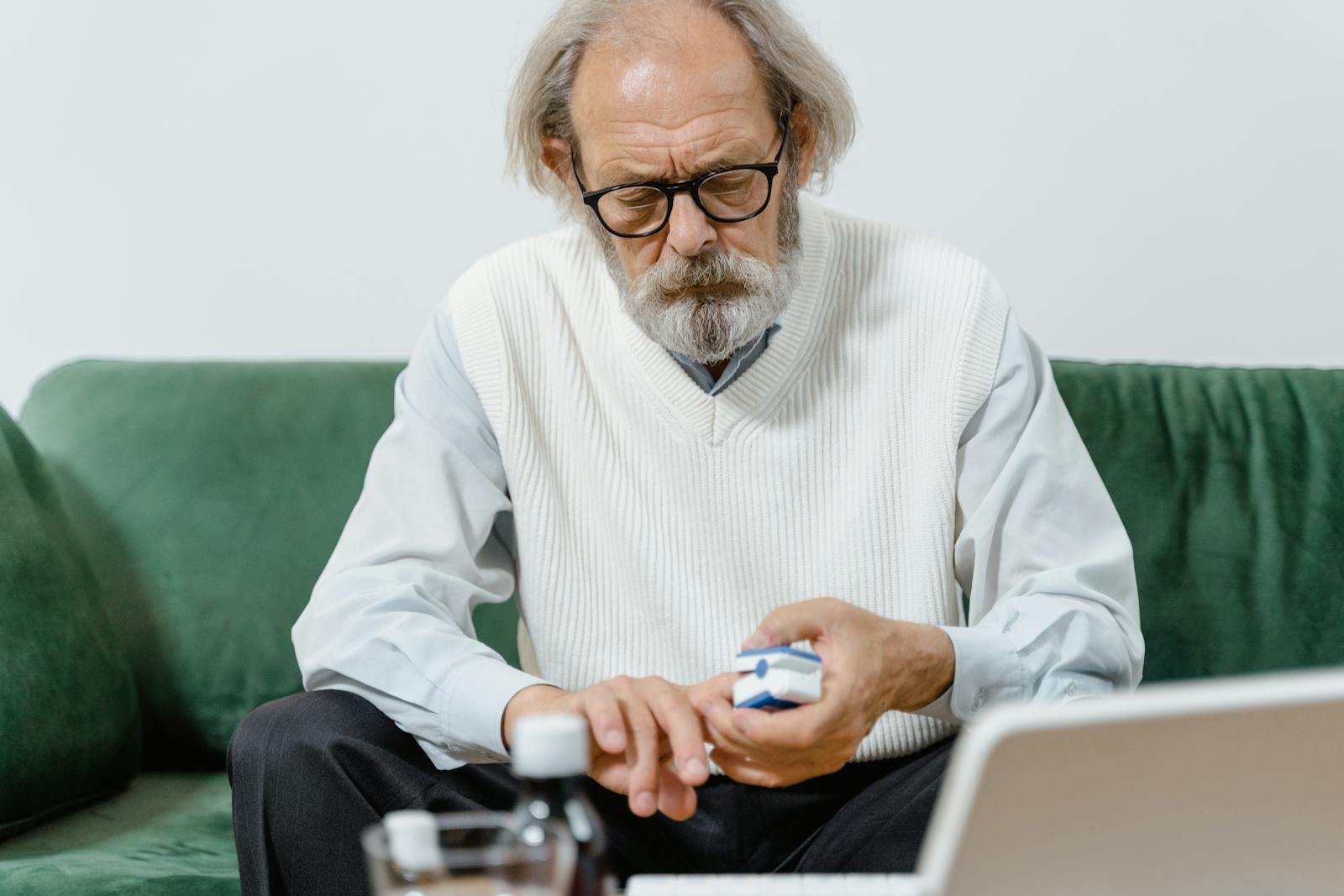 Adult carefully examining medication and reading instructions, representing informed consumer safety