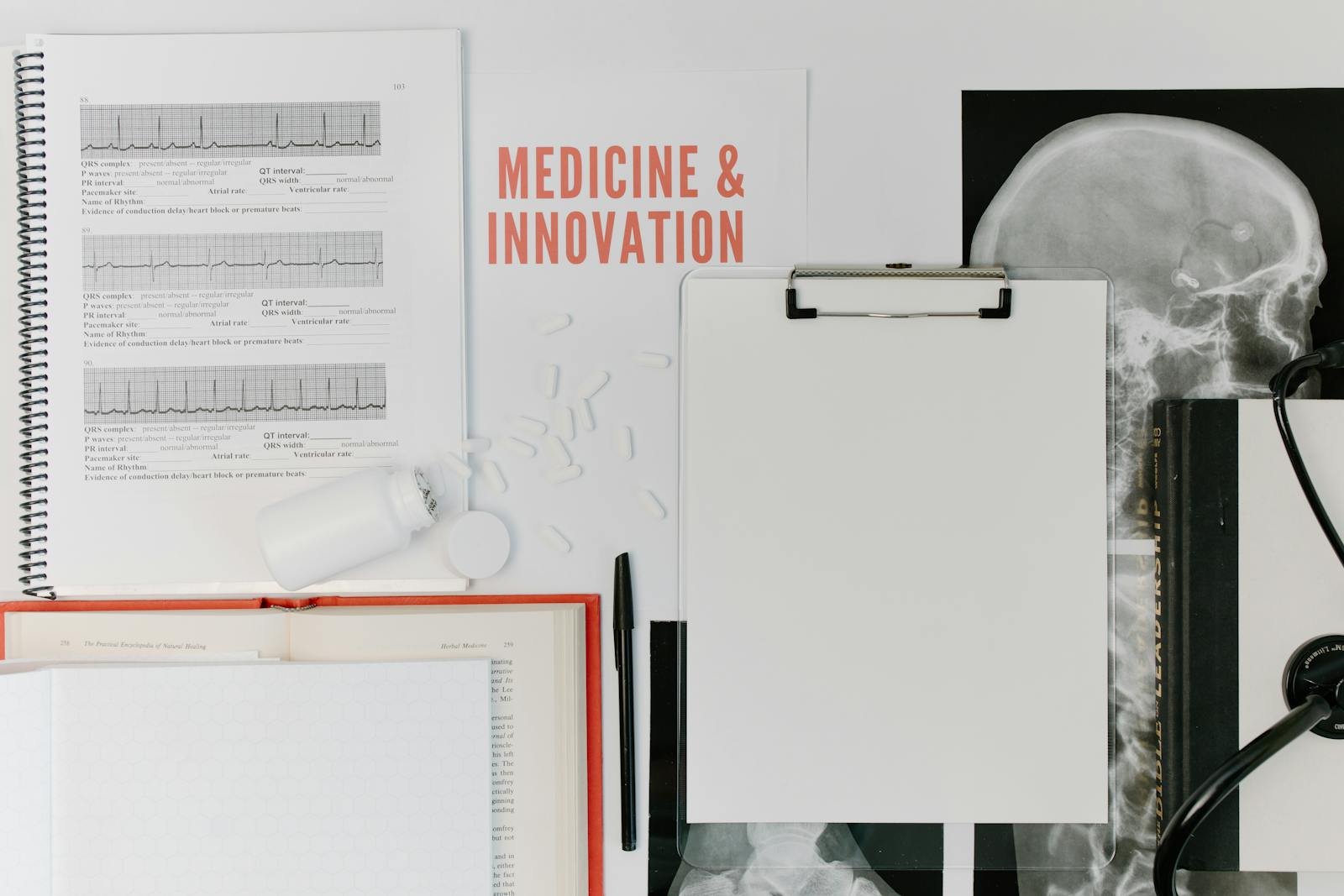 Flat lay of medical research documents and equipment emphasizing scientific innovation